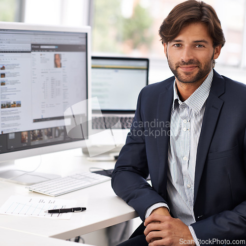 Image of Portrait, office and businessman at desk with computer, screen and HR website online. Human resources, recruitment career and professional with confidence, internet research and consulting agency.