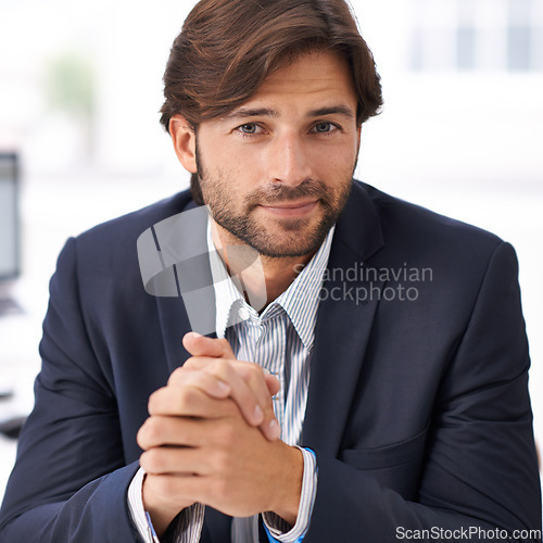 Image of Portrait, office and businessman at desk with confidence, commitment and small business owner at startup. Professional career, happy face and entrepreneur with pride, project management and smile.