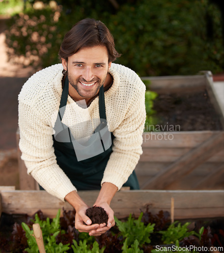 Image of Portrait, farmer and man with soil for agriculture, smile and ecology for sustainability of nature. Face, gardener and happy person with fertilizer, earth and dirt for growth of plants in environment
