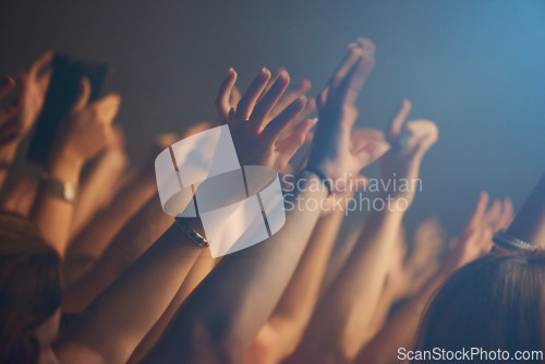 Image of Hands, crowd and celebration or friends at music festival, collaboration and freedom at nightclub. People, closeup and weekend at party or social event, concert and community or together at show