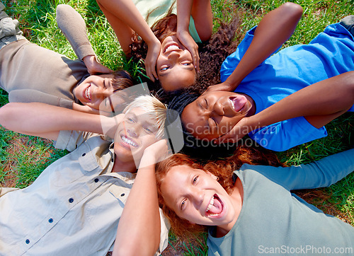 Image of Children, friends and cover ears in nature for silence, quiet and ignoring noise in outdoors. Diversity, kids and laugh for humor or funny joke on grass, top view and bonding or playful in childhood