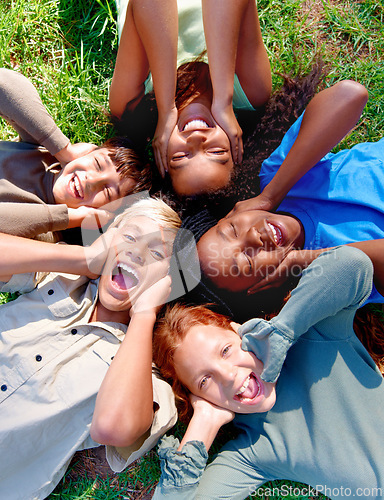 Image of Children, friends and cover ears in outdoors for silence, quiet and ignoring noise in nature. Diversity, kids and laughing for humor or funny joke on grass, top view and bonding in childhood for fun