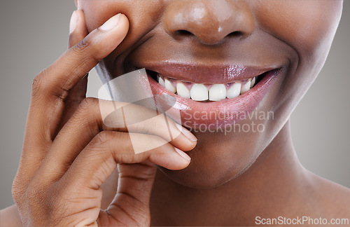 Image of Smile, beauty and lips of black woman on gray background for wellness, cosmetics and makeup. Dermatology, teeth and closeup of natural face of person with gloss, lipstick and skincare in studio