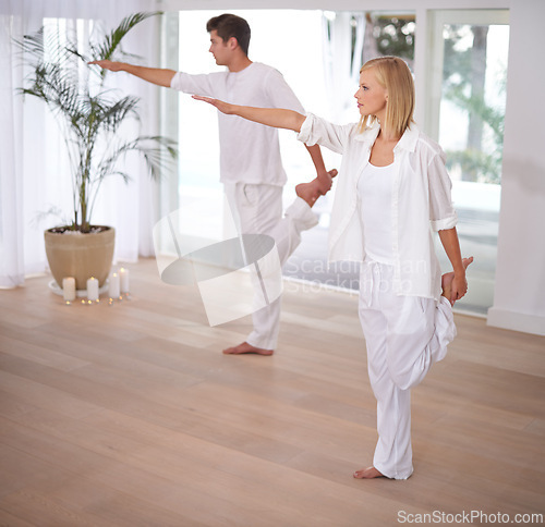 Image of Yoga, stretching and couple do pilates in home for wellness, mindfulness and training. Fitness, exercise and man and woman balance in house for bonding, healthy body and workout together in morning