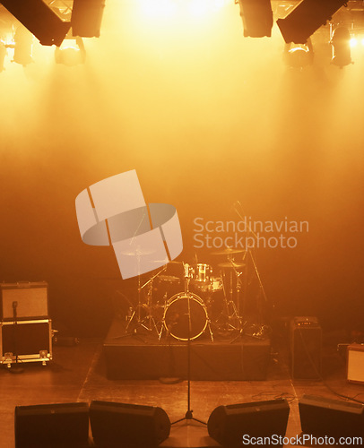 Image of Concert, band and drums at stage for performance with instruments for live sound or gig. Music festival show, ready or background with lights or speakers in an empty theater at night for a rock event