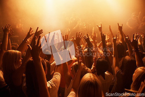 Image of Music, concert and crowd of people dancing for performance with lighting equipment at party. Event, entertainment and group of fans or audience at festival, disco or rave with energy for song.
