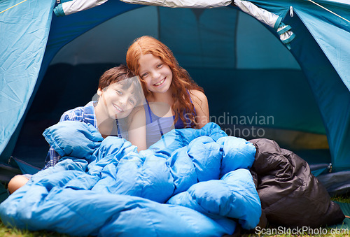 Image of Portrait, camping and children hug in a tent sleeping bag with love, care and bonding in nature together. Happy family, kids and siblings wake up outdoor with trust, games and fun on forest sleepover