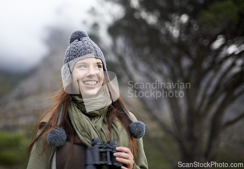 Image of Happiness, binocular and nature woman on hiking journey, travel adventure or relax walk. Mockup space, trekking woods and hiker smile for jungle exploration, bird watching and looking at outdoor view