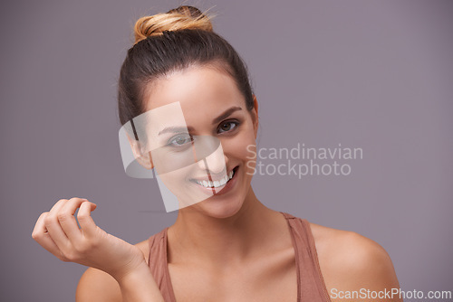 Image of Skincare, portrait and young woman in a studio with health, wellness and dermatology routine. Cosmetic, confident and female person with natural facial beauty treatment isolated by gray background.