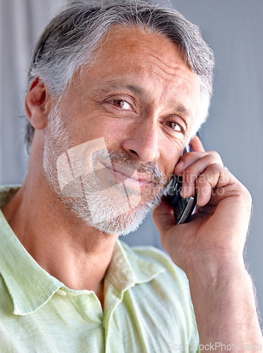 Image of Mature, portrait or happy man on a phone call talking or listening for communication with smile. Face, retirement or male senior person in home calling to chat in conversation or speaking on mobile