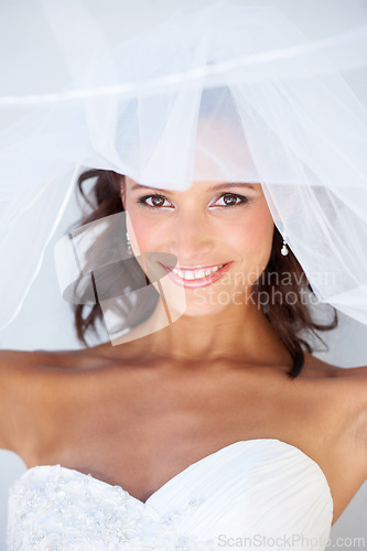 Image of Bride, wedding dress and portrait with veil for ceremony, beautiful and happiness with smile, prepare and makeup. Marriage, commitment and elegant gown for big day, person and clothes for woman