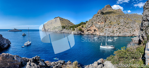 Image of Pleasure boats stranded in the cove, Sa Calobra