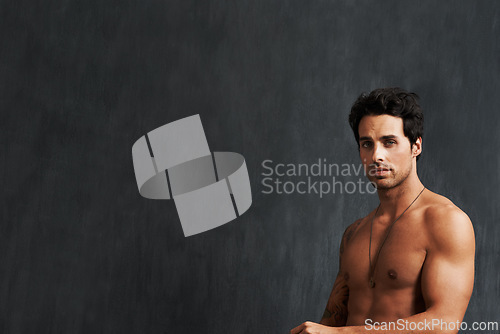 Image of Portrait, fitness model and man shirtless, strong and muscular results from strength training, body building and workout. Bodybuilder, chalkboard mockup space and studio person on black background