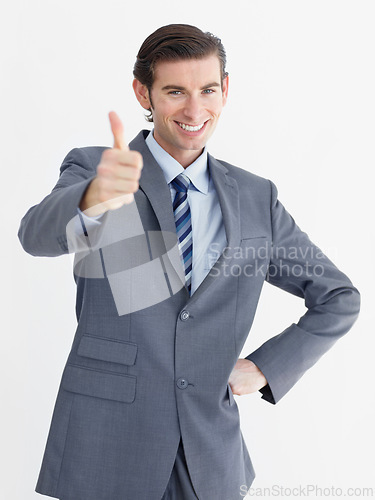 Image of Portrait, businessman and happy thumbs up in studio with mockup for decision on white background. Corporate, male person and smile in excitement with gesture for encouragement, choice and support