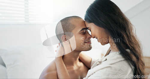 Image of Couple, hug in bed and smile for love and commitment, talking and forehead touch, romance and chemistry. People in relationship, bonding and care at home, communication or trust with peace and calm