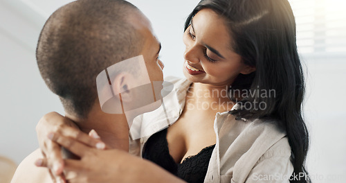 Image of Couple, hug and kiss in bedroom with smile for love and commitment, romance for happiness and chemistry. People in healthy relationship, bonding and care at home with trust and partner for life