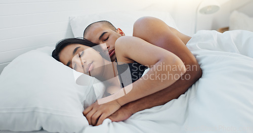 Image of Couple, hugging and sleeping in bed together, love and resting or comfortable at home on weekend. People, bedroom and security in embrace, bonding and nap on sunday morning and relaxing or dreaming