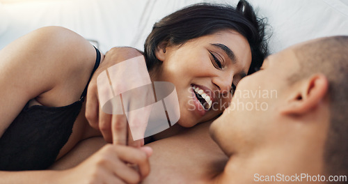 Image of Couple, hug and loving conversation in bed on sunday morning, bonding and hugging on weekend. People, embrace and communication in relationship at home, kiss and resting or greeting for waking up