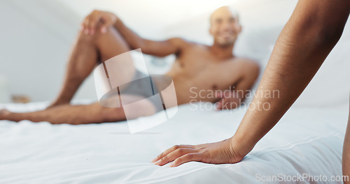 Image of Couple, bed and hand with underwear on duvet for love, romance or intimacy in affection, morning or seduction at home. Closeup of woman, man or lovers lying in bedroom for compassion on anniversary