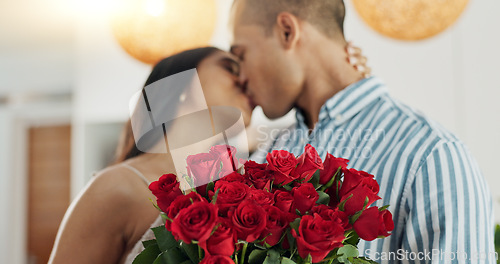 Image of Couple, flowers and kiss for anniversary celebration, marriage and loyalty or commitment to love. People, happy and romance for relationship milestone, bonding and plant gift for support at home