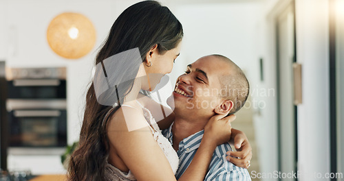 Image of Couple, hug and kissing for love at home, happy and support in marriage and embrace for romance. People, spin and bonding together for relationship, lovers and commitment or loyalty in apartment