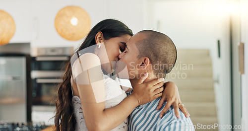 Image of Couple, hug and kissing for love at home, happy and support in marriage and embrace for romance. People, spin and bonding together for relationship, lovers and commitment or loyalty in apartment