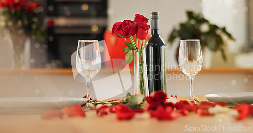 Image of Wine, glass and romance on valentines day for celebration of love, anniversary or honeymoon in still life. Flowers, dinner and elegant date in dining room of home for event, milestone or occasion