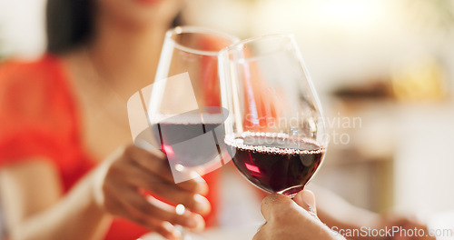 Image of Couple, hands and toast with red wine for celebration of love, romance and valentines day on their anniversary. People or lover on date with glasses, drinks and alcohol for cheers, success and luxury