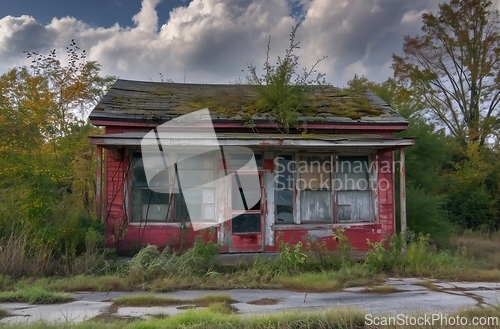 Image of Abandoned Red Building With Green Roof in Dilapidated State