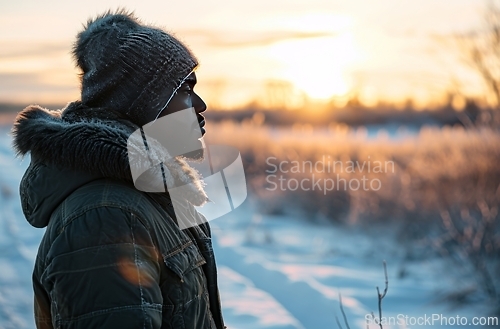 Image of Person Standing in Snow With Hat On