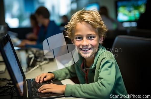 Image of Young Boy Sitting in Front of Laptop Computer