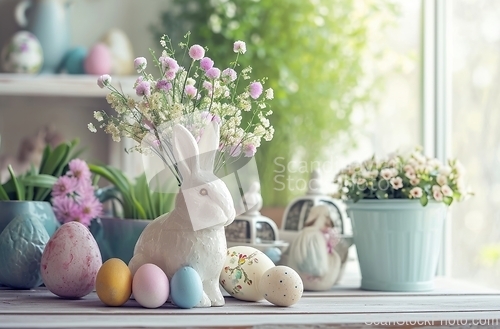 Image of White Rabbit Sitting on Table Next to Flowers