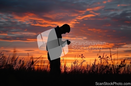 Image of Man Standing in Field at Sunset, Captivating Serenity in Natures Embrace