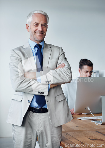 Image of Senior businessman, portrait and confidence in career, agency and pride for mentoring in office. Male person, arms crossed and smiling for support in management, advisor and computer for planning