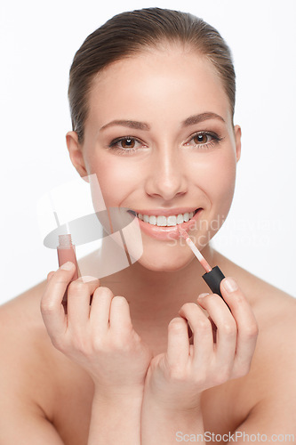 Image of Woman, portrait and skincare for beauty, lipstick and makeup with cosmetology and wellness on white background. Face, cosmetic product for lips and clean skin, glow or shine with smile in studio