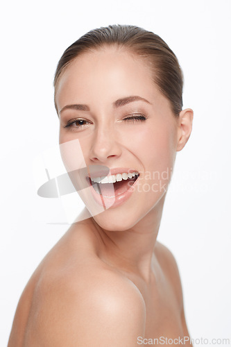 Image of Portrait, smile and woman wink for skincare, flirt or natural beauty isolated on white studio background. Face, blink and happy model in cosmetics excited for spa facial treatment for healthy skin