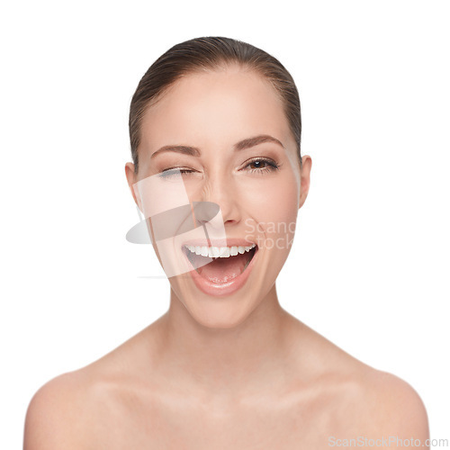 Image of Portrait, happy and woman wink for skincare, flirt or beauty makeup isolated on white studio background. Face, blink and smile of model in cosmetics excited for spa facial treatment for healthy skin