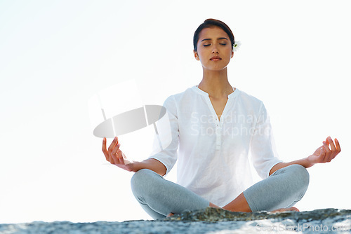 Image of Woman, meditation and yoga in zen for spiritual wellness, awareness or outdoor beach with sky background. Calm female person or yogi meditating for inner peace, breathing or health on mockup space