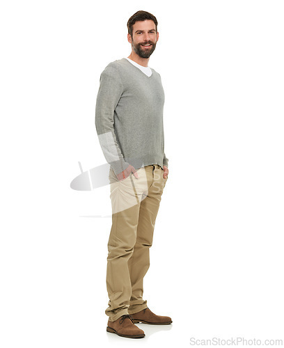 Image of Happy, portrait and cool man in studio with casual clothes for fashion in V neck pullover top, pants and confidence. Young model or person from the USA with relaxed style and on a white background