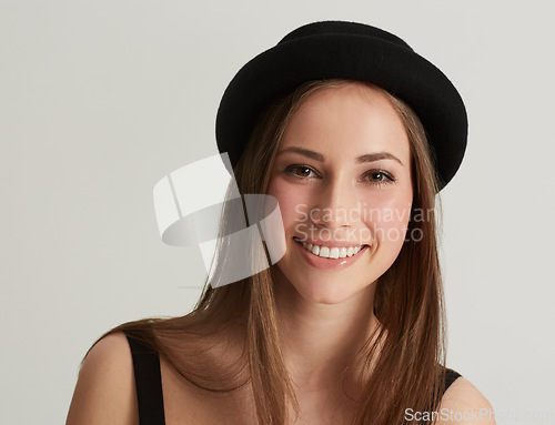 Image of Woman, fedora and fashion with portrait in studio with confidence, pride and retro style by white background. Hipster girl, model or person with trendy hat, clothes and happy with face in Argentina