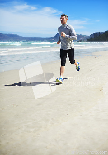 Image of Fitness, mature or man on beach running for exercise, training or outdoor workout at sea. Sports person, fast runner or healthy athlete in nature for cardio endurance, wellness or challenge on sand