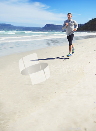 Image of Sand, space or man at sea running for exercise, training or outdoor workout at beach for fitness. Sports person, mature runner or healthy athlete in nature for cardio endurance, wellness or mockup