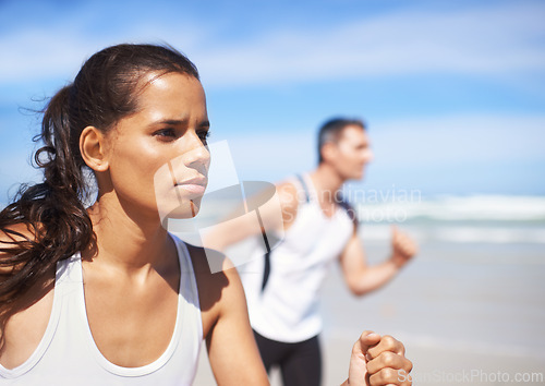 Image of Fitness, woman or people on beach running for exercise, training or outdoor workout at sea. Sports couple, runners or healthy athletes in nature for cardio endurance, wellness or challenge on sand