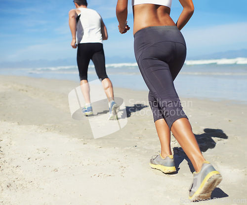 Image of Running, beach and man with woman, fitness and cardio with workout and training for wellness. Healthy, runner and athlete with practice and vacation with water and waves with sunshine or getaway trip