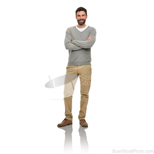 Image of Happy, portrait and man in studio with casual clothes for fashion in V neck pullover, pants and confidence or arms crossed. Young model or person from USA with relaxed style and on a white background