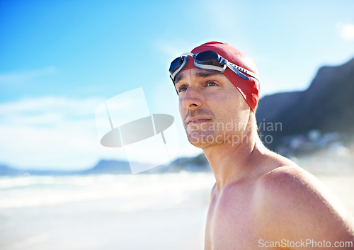 Image of Beach, goggles and man with cap, travel and swimmer with vacation and summer break with getaway trip. Person, athlete and guy with holiday or seaside with sunshine and fitness with wellness or energy