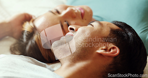 Image of Couple in bed talking, happy and conversation in the morning. Love, dating and multicultural man and woman speaking, bonding and have a discussion in bedroom. People in a relationship laying together