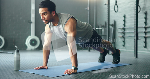 Image of Fitness, man and pushups for muscle, exercise or training workout for strength or power at the gym. Athletic male in sport exercising lifting body with arms on the floor for strong muscles indoors