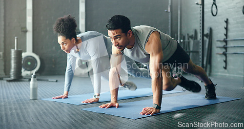 Image of Couple, fitness and gym workout of training friends together for a core strength exercise for abs. Strong, sports and athlete wellness cardio of people doing a sport in a health club or studio