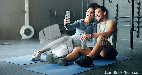 Image of Selfie, fitness and couple training with a phone, happy with workout and smile for exercise at the gym. Wellness, photo and man and woman with love for sports and live streaming on social media